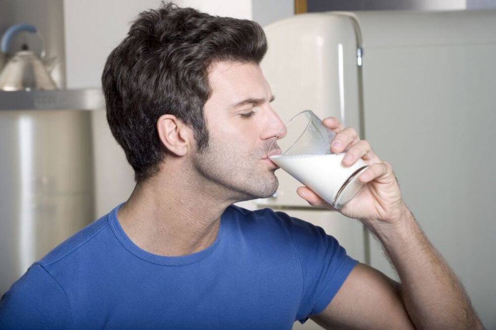 A man drinking milk